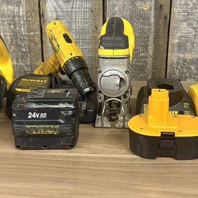 An Assortment of DeWalt Cordless Power Tools and Charging Accessories