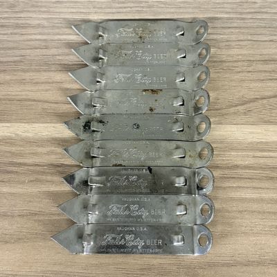 A Collection of Vaughan USA Falls City Beer Metal Can and Bottle Openers