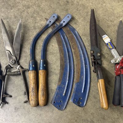 A Collection of Vintage Blue Grass Brand Agricultural and Garden Tools