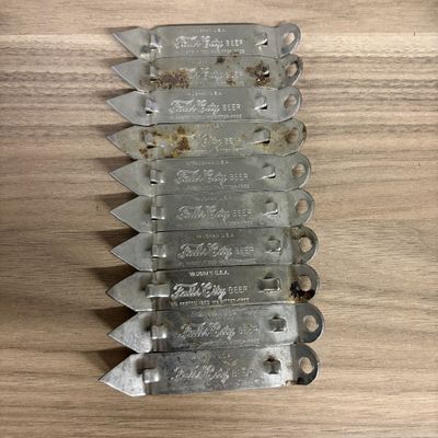 A Group of Vintage Falls City Beer Vaughan USA Metal Church Key Openers