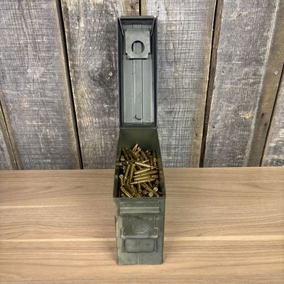 A Group of .223 Remington FMJ Rifle Ammunition in a Metal Storage Can