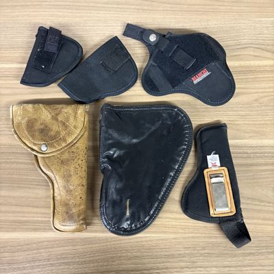 An Assortment of Firearm Holsters and a Browning Pouch