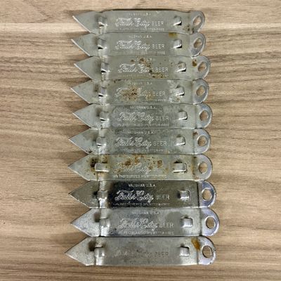 A Group of Vintage Falls City Beer Metal Can and Bottle Openers by Vaughan USA