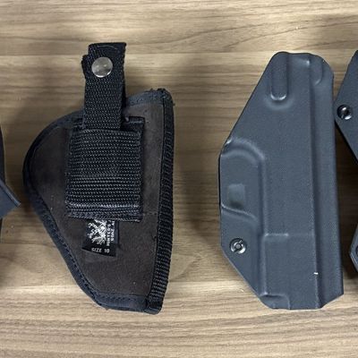 An Assortment of Textile and Molded Plastic Handgun Holsters and Magazine Pouches