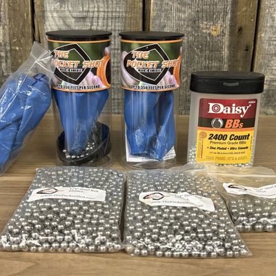 A Collection of The Pocket Shot and Daisy Slingshot Accessories and Ammunition