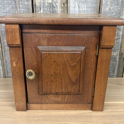Small Single Door Stained Wood Cabinet with Raised Panel