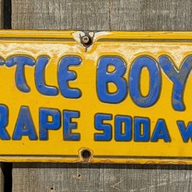 Vintage Little Boy Blue Grape Soda Water Porcelain Enamel Embossed Sign