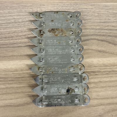 A Collection of Vintage Vaughan Stamped Steel Falls City Beer Church Key Openers