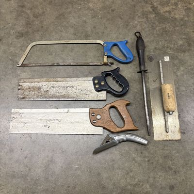 An Assortment of Vintage Hand Saws and Finishing Tools