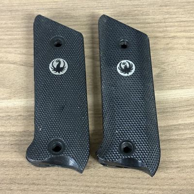 A Group of Black Checkered Synthetic Pistol Grip Panels with Bird Emblem Medallions