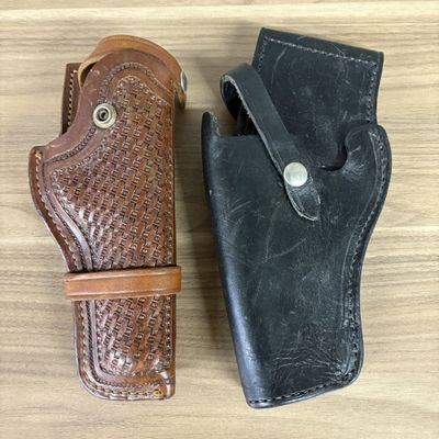 Two Leather Handgun Holsters Including One Stamped Browning