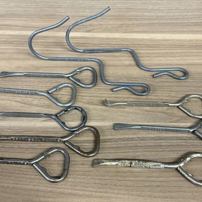 A Collection of Vintage Paint Can and Bottle Openers with Porter Paints Pot Hooks