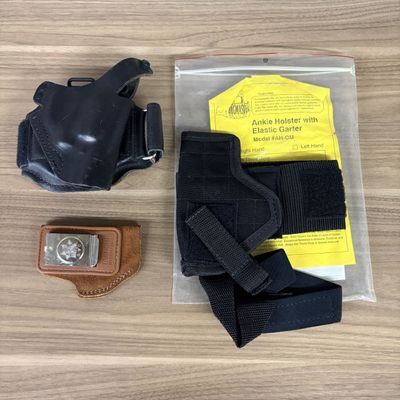 An Assortment of Concealed Carry Handgun Holsters Including Bianchi and Bagmaster