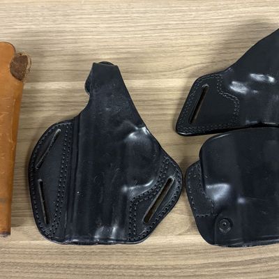 A Group of Leather Firearm Holsters and Magazine Pouch Including Smith and Wesson Bianchi and Blackhawk Examples