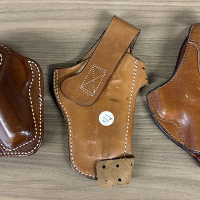 A Trio of Vintage Leather Pistol Holsters Including Milt Sparks and Safariland Examples