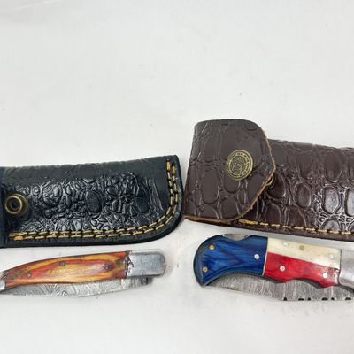TWO DAMASCUS STEEL FOLDING KNIVES