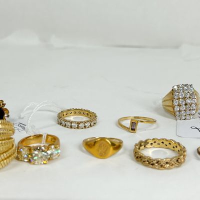 COLLECTION OF NINE GOLD PLATED RINGS