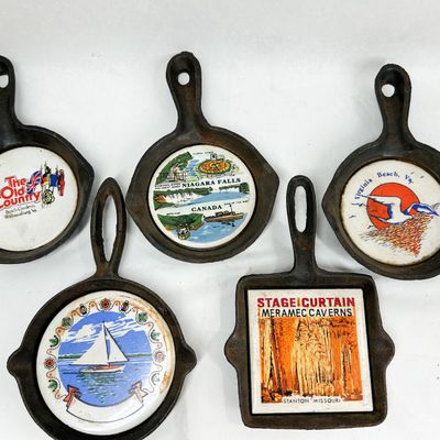 ASSORTMENT OF CAST IRON SOUVENIR TRIVETS