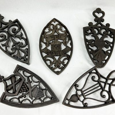 THE ROYAL W AND ASSORTED CAST IRON TRIVETS