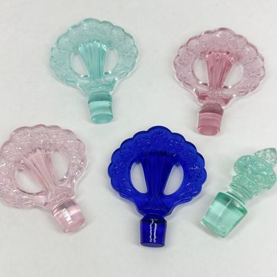 GLASS PERFUME STOPPERS, MID-20TH CENTURY