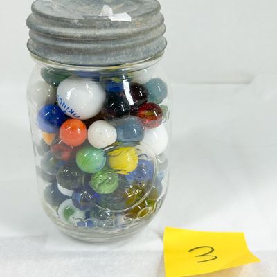 ASSORTED GLASS MARBLES IN MASON JAR