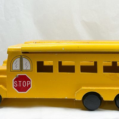 A PAIR OF VINTAGE WOODEN SCHOOL BUS PULL TOYS