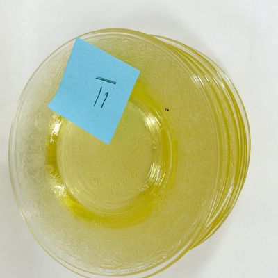 SET OF ELEVEN YELLOW GLASS PLATES