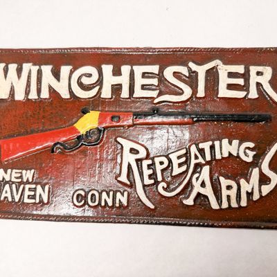 WINCHESTER CAST IRON ADVERTISING SIGN