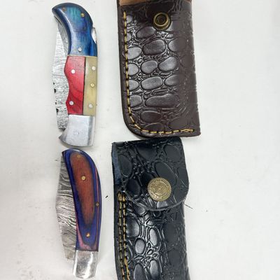 TWO DAMASCUS STEEL FOLDING KNIVES