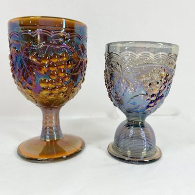 TWO IRIDESCENT CARNIVAL GLASS DRINKING VESSELS
