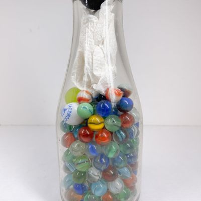 LINCOLN HIGHWAY DAIRY BOTTLE AND MARBLES