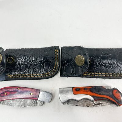 TWO DAMASCUS STEEL FOLDING KNIVES