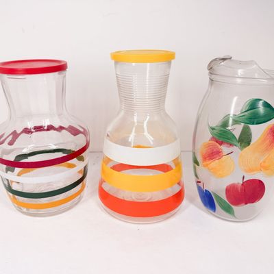 THREE GLASS JUICE CARAFES AND PITCHER