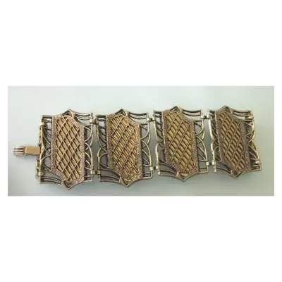 Sale Photo Thumbnail #4: Retro Faux Tortoiseshell Lucite Bracelet
7.5” long
Wonderful very wide 4 section bracelet featuring bold swirl lucite faux tortoise set in bronze tone metal. The bracelet is finished with a foldover clasp.

The bracelet is 2-1/4" wide by 7-1/2" wide. Be