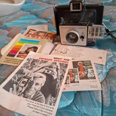 vintage Polaroid Super Colorpack Land Camera, a rigid-body camera & Leather Case