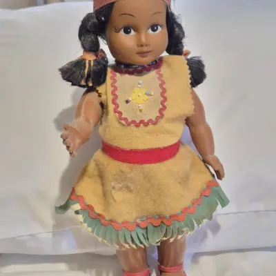 vintage souvenir or tourist doll from the mid-20th century, styled to resemble Native American 