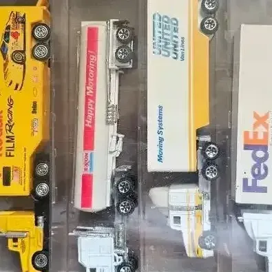 vintage collection of miniature die-cast semi-truck transporters and racing Haulers, 