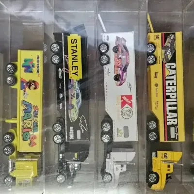 vintage collection of miniature die-cast semi-truck transporters and racing Haulers, 
