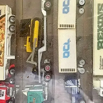 vintage collection of miniature die-cast semi-truck transporters and racing Haulers,