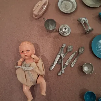 MOSTLY METAL MINIATURE DISHES AND A SMALL BABY DOLL
