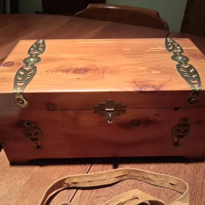CEDAR BOX, LEATHER PURSE, PUZZLES AND 2 HAND MUFFS