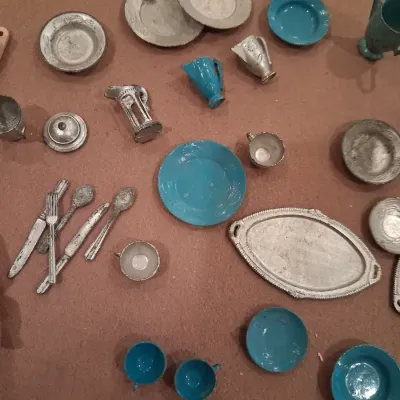 MOSTLY METAL MINIATURE DISHES AND A SMALL BABY DOLL
