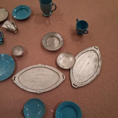 MOSTLY METAL MINIATURE DISHES AND A SMALL BABY DOLL