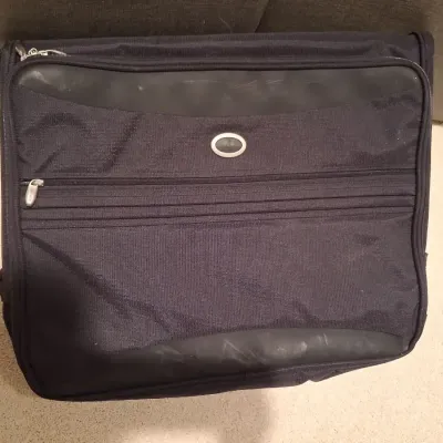2 VINTAGE AMERICAN TOURISTER SUITCASES AND A GARMENT BAG