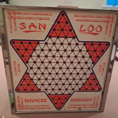 1935 MONOPOLY GAME AND ANTE-UP-RUMMY BOARD WITH MARBLES STORED IN THE FRAME PLUS PLAYING CARDS