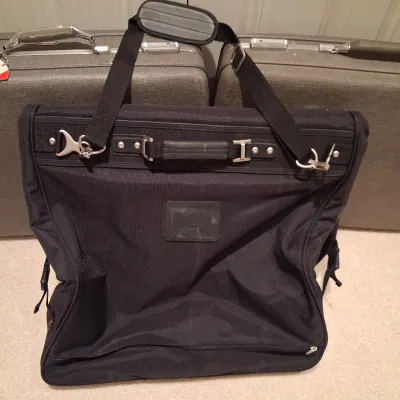2 VINTAGE AMERICAN TOURISTER SUITCASES AND A GARMENT BAG