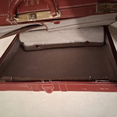 LEATHER SUITCASE AND SIGNED POSTER "PLAZA DAWN"