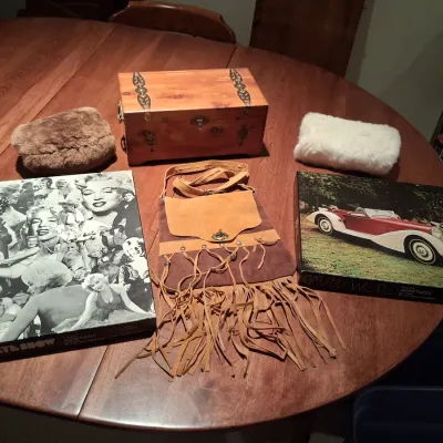 CEDAR BOX, LEATHER PURSE, PUZZLES AND 2 HAND MUFFS