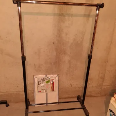 ADJUSTABLE GARMENT RACK ON WHEELS AND A STORAGE DRESS BAG