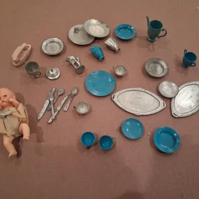 MOSTLY METAL MINIATURE DISHES AND A SMALL BABY DOLL